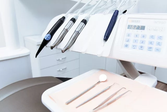 white background with dental tools and equipment