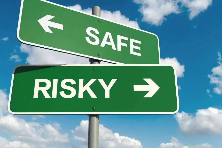 sign showing risk and safe